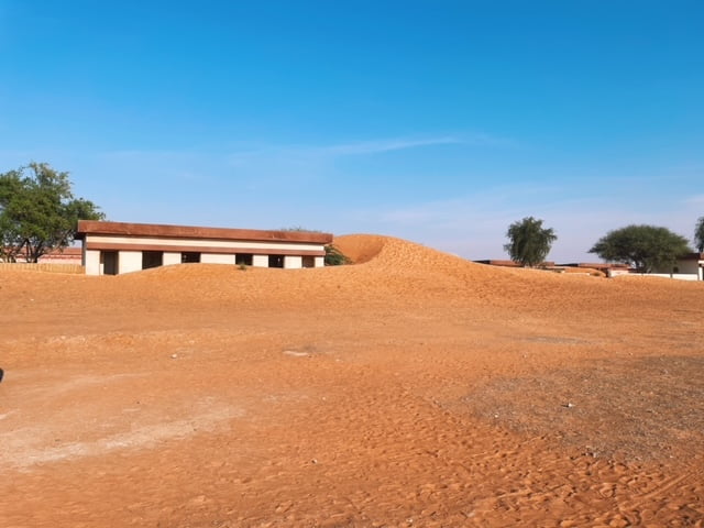Al Madam buried village