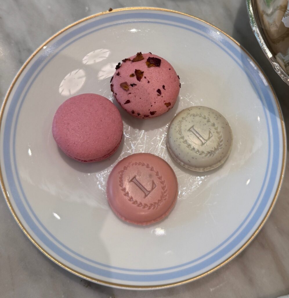 Two macarons in rose and Isphahan flavours and two Eugénies in vanilla and rose flavours, served at Ladurée Dubai Hills Mall Royal Afternoon Tea.
