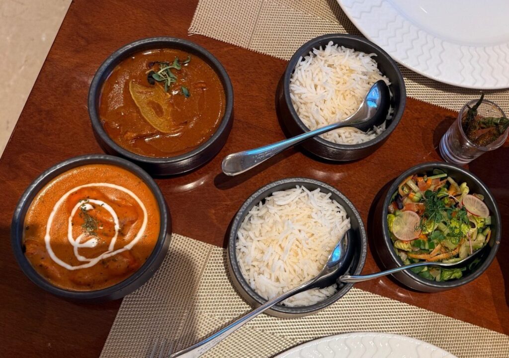 Punjab Grill Business Bay lunch spread with curries, rice and salad
