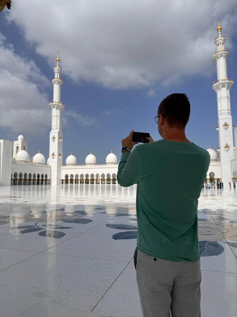man taking photos inside the grand mosque during ramadan