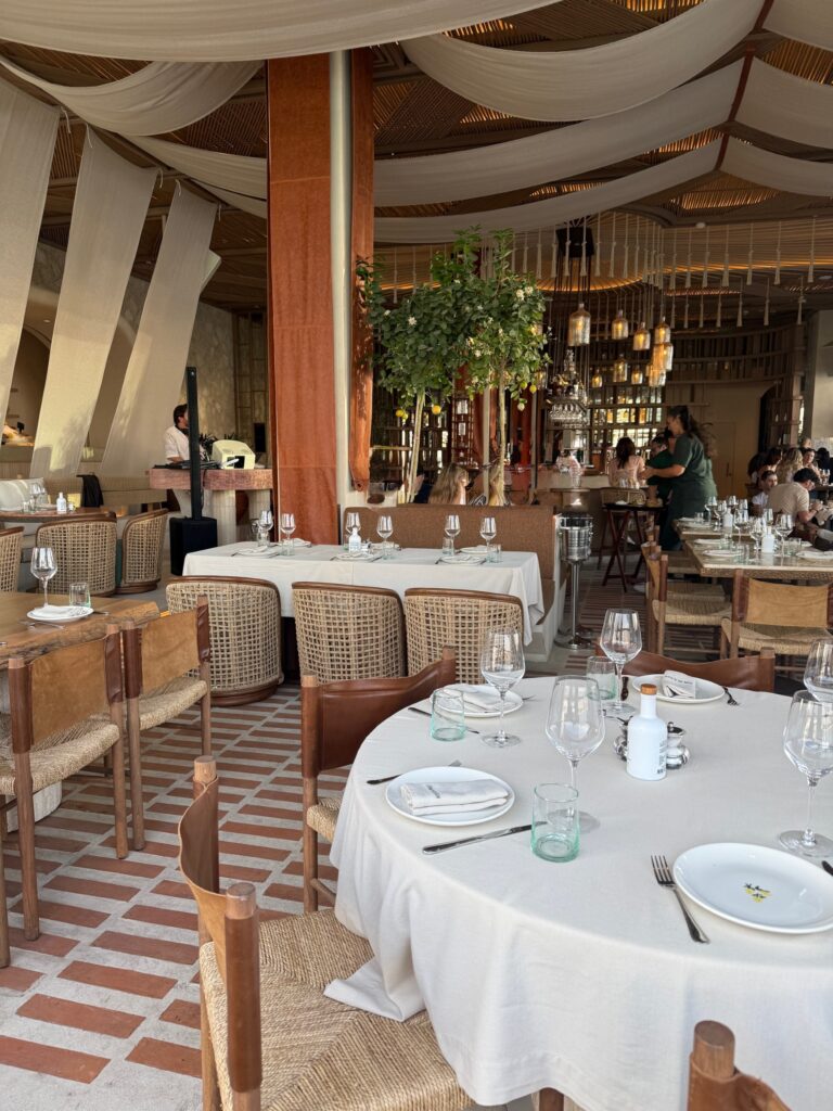 Interior of Son of a Fish Dubai restaurant showing stylish seating, ambient lighting