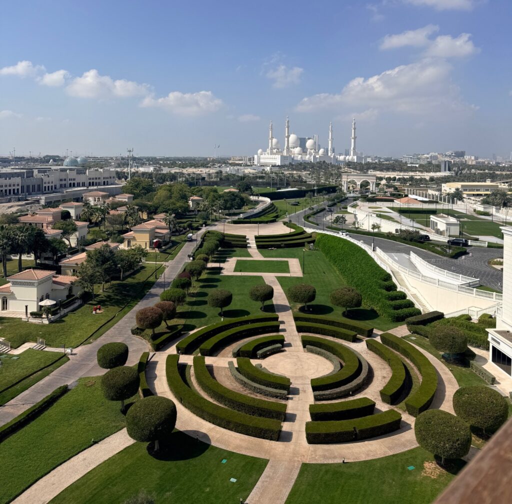 View of The Grand Mosque and Ritz Carlton Abu Dhabi Grand Canal hotel grounds from hotel room balcony,