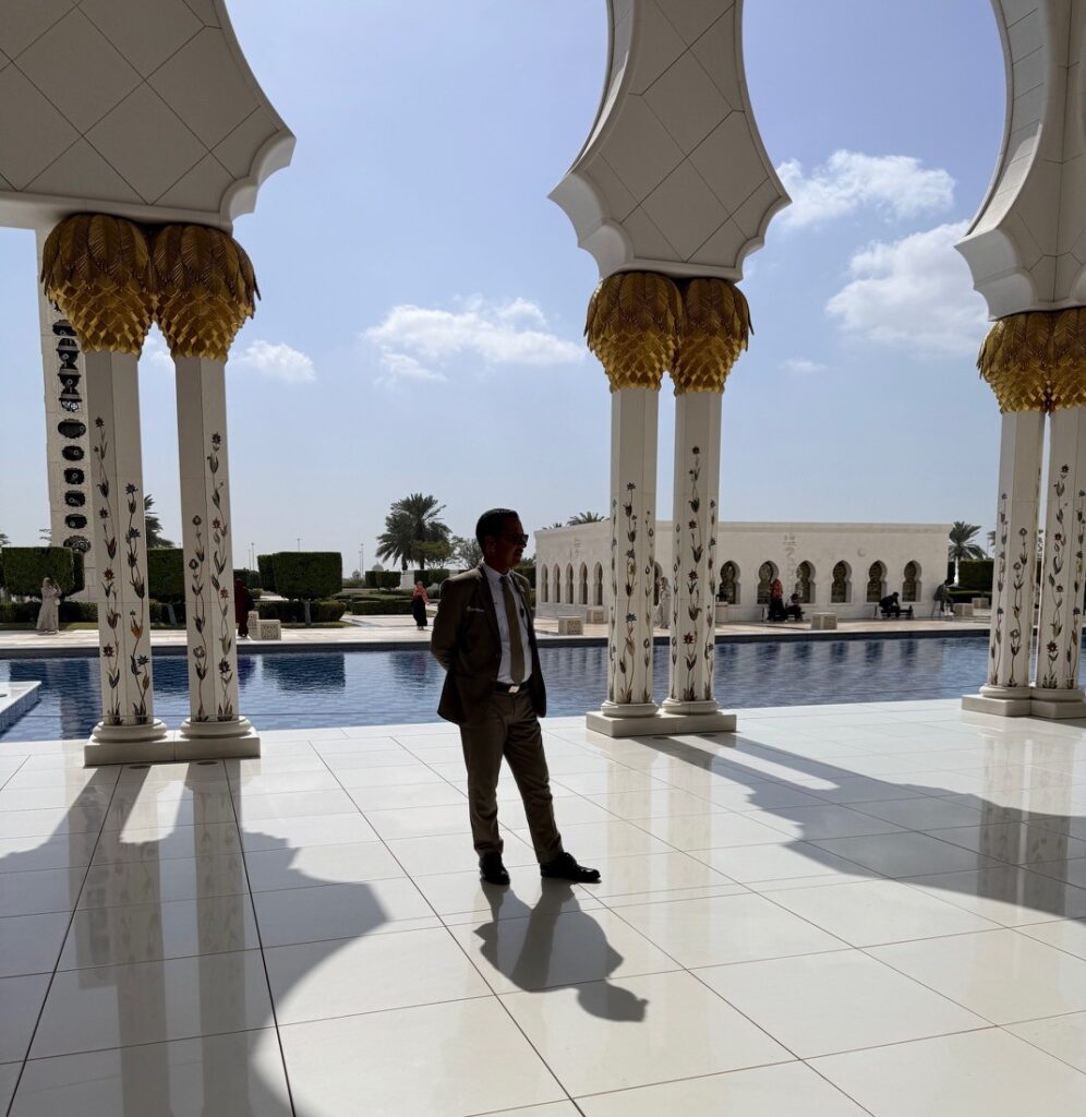 Grand Mosque Abu Dhabi security staff inside the mosque monitoring visitors and maintaining rules.