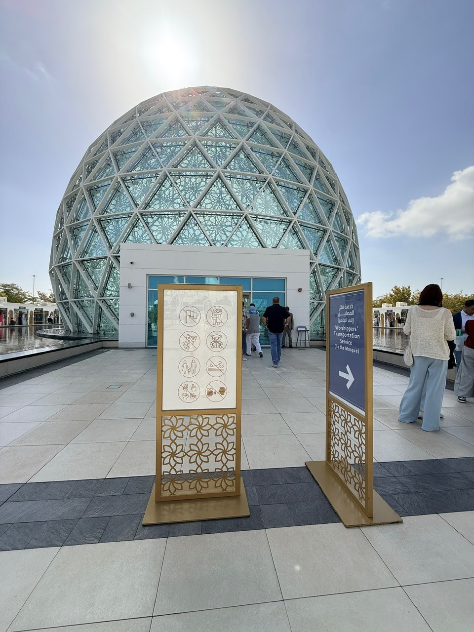 Grand Mosque Abu Dhabi Visitor Centre entrance with security and ticket scanning area.