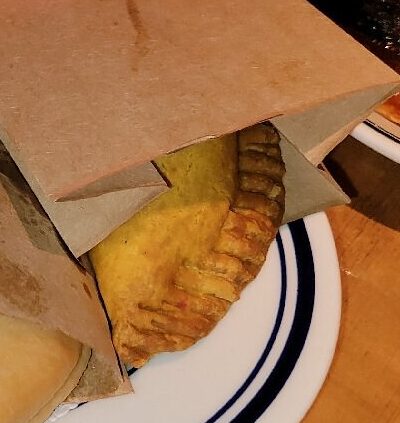 Mini Jamaican beef patties at Miss Lily’s Caribbean restaurant in Dubai, golden and flaky.