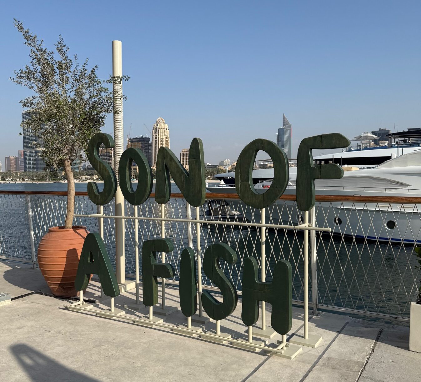 Son of a fish outdoor sign visible at Dubai Marina Harbour